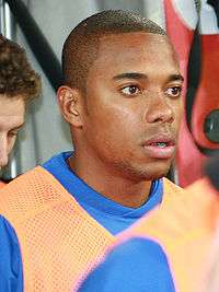 Head and shoulders of a young man with close cropped hair, facing right.