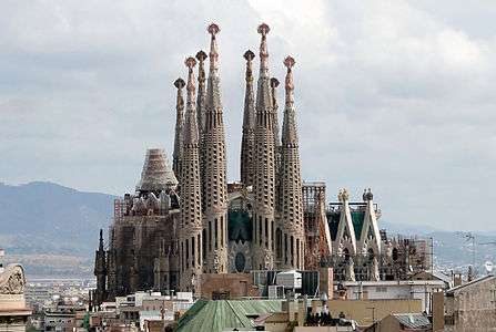 A large palace structure with many towers under construction.