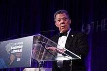 Santos accepting the Inter-American Dialogue's Distinguished Lifetime Achievement Award for Peace at the Four Seasons Hotel in Washington, DC.