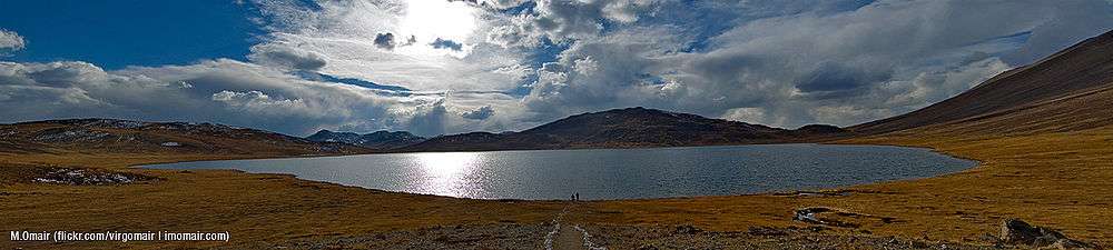 Lake with low mountains in the background