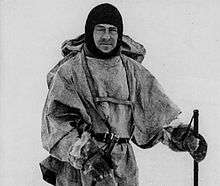 Man in winter coat wearing a balaclava or ski mask style headgear.