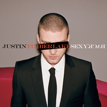 A young man with a buzz cut, wears a two-piece black suit, with a white shirt and black tie. A black horizontal rectangle covers his right eye, while his right blue eye can be seen. In capitals, "Justin", "Timberlake", and "SexyBack" is written in black, orange, and white font, respectively. The word "Back" is spelled backwards.