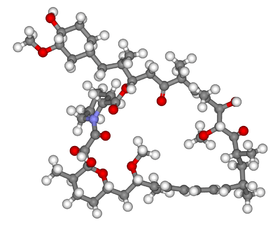 A 3D skelton of the mollecular structure consisting of over around fifty small grey spheres representing carbon, linked by grey tubes. Attached to these are white spheres representing hydrogen. There are a handful of red spheres representing oxygen, and one blue sphere, which is nitrogen.