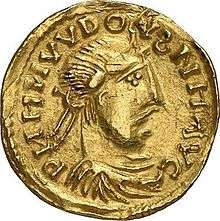 A coin depicting the head of a man