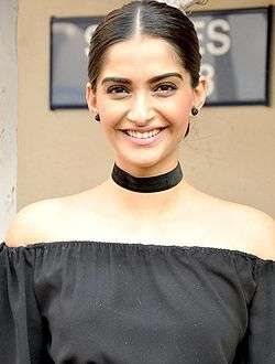 A picture of Sonam Kapoor, looking and grinning at the viewer.