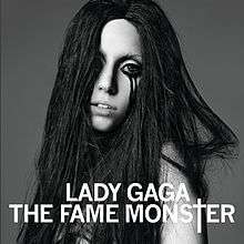 Black-and-white image of Lady Gaga with black, disheveled hair, and black liner around her eyes, dripping down her cheeks.