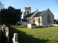 White building with square tower.