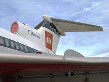 A left-quarter view of a jet airliner wing and tailplane. On the tail fin are the words 'Trident Two' and the letters 'BEA' and G-AFVB'.