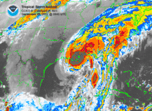 Colorized image of a hurricane with no eye, but clear banding features. Darker magenta shades indicate strong thunderstorms, and lighter, bluer shades indicate weaker convection.