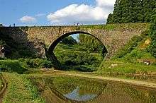 A stone arch bridge.