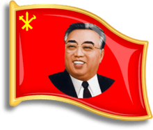 Red, flag-shaped pin with a smiling Kim Il-sung