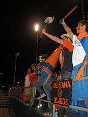 Students cheering at football game