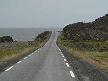 A road running next to the sea