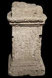 Narrow stone altar, with inscription