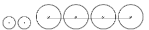 Diagram of two small leading wheels, and four large driving wheels joined by a coupling rod