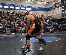 Two competitors in an Amateur Wrestling match