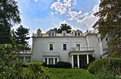 Southern portion of east elevation, part of the two-story white house