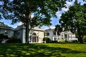 Rear elevation, classically ornate side of the two-story white house